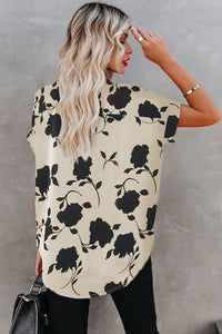 Cream and black floral short sleeve blouse. Has raglan style with cuffed short sleeves and v-neck. 100% polyester textured lightweight fabric. This is roomy for sizes!! 