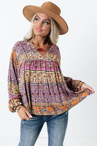 Boho print in purples, pinks, rust and turquoise colors. Nice easy pullover blouse with V-Neck and elastic cuffed puff sleeves. Roomy fit top! 