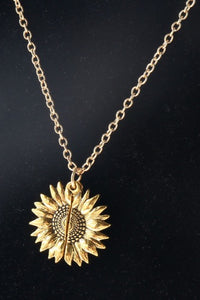 Cute gold sunflower necklace that opens up with a saying inside to brighten up your day.