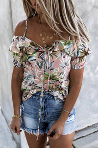 Mauve Floral print strappy ruffly blouse. The spaghetti strap and cold shoulder highlights neck and shoulder. Ruffled design makes this cool and casual top trendy and stylish. Lace-up design adds some extra flair. Nice cool silky feel flowy fabric. Perfect for Spring and Summer. 