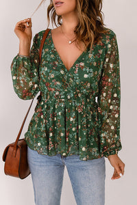 Green floral print blouse with elastic cuffs and waistband for a fitted look. Is fully lined. Designed with a V-Neck and peplum style for a carefree fit. Pair it with jeans, dress pants or even skirts and shorts. This top runs snug so you might want to size up from your regular size from my clothing line. Polyester. 