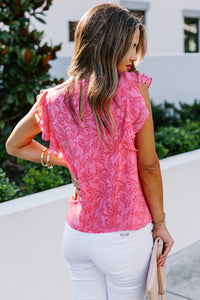 Pink floral print crepe with ruffled flutter cap sleeves blouse. Has back button keyhole closure. Nice relaxed fit top made of lightweight polyester blend no stretch fabric. Great top for warm sunny days. Front bodice is lined. 