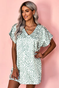 Sage leopard print silky smooth cotton blend flowy mini dress with pockets. Very roomy! Could downsize. 