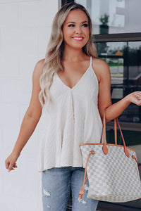 Beautiful white textured babydoll tank, made of high quality fabric. This trendy strappy tank has a V-neck style with babydoll design. This can be worn dressed up or casual. Wear alone or throw on a cardigan for a chic style. 