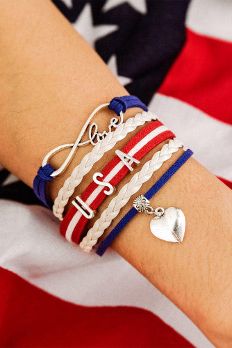 USA patriotic bracelet made with 5 bands connected with silver clasps to make a one piece bracelet. Bands contain braided and straight strings or ribbon adorned with metal attachments like USA lettering and a dangling silver heart. Very nice quality bracelet.  Clasp chain can adjust for sizing. 