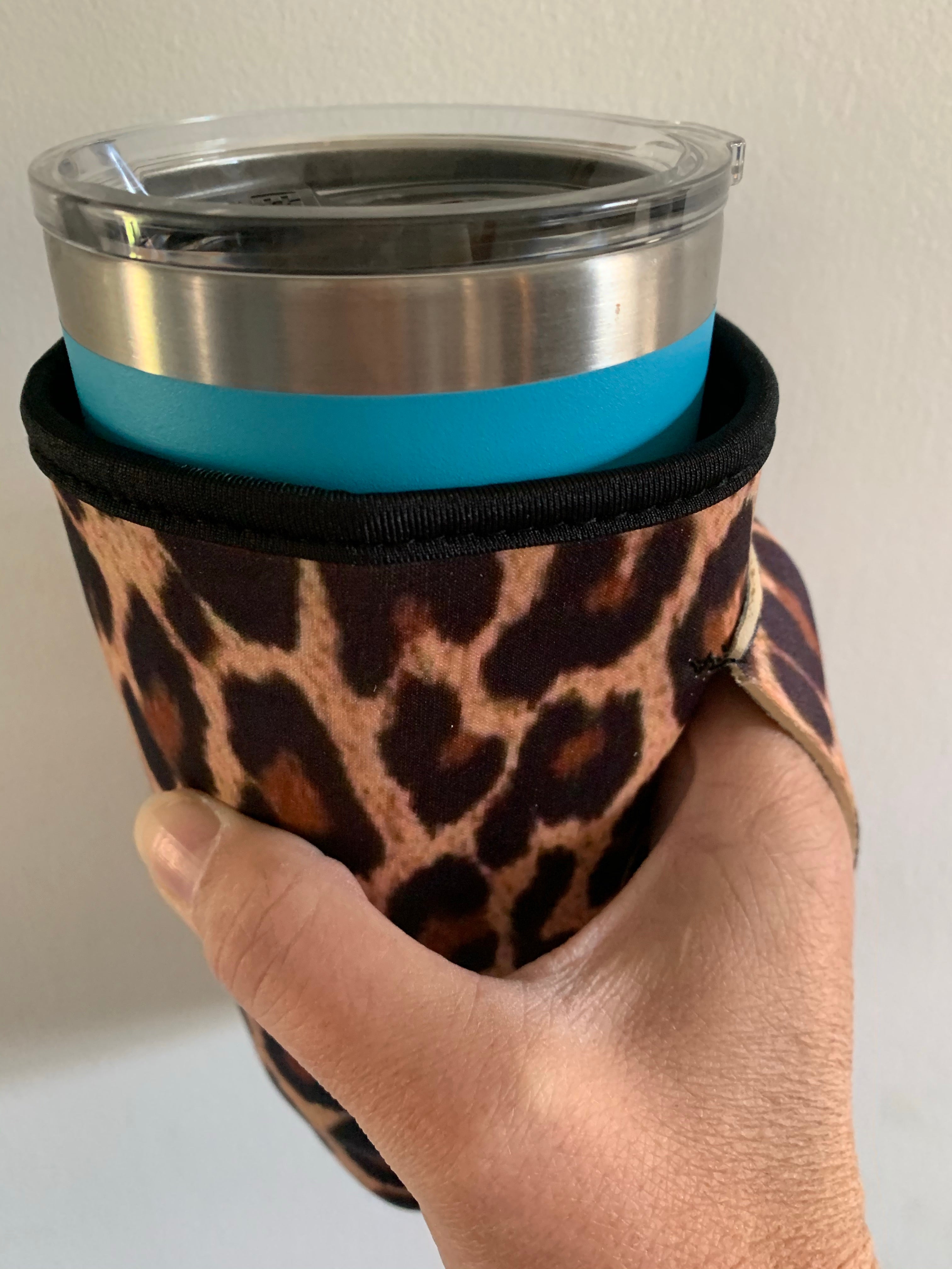 Leopard print slip on travel mug cover.  Fits 20 oz mugs
