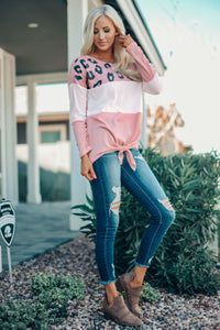 This Pink Color Block Leopard Tie Top Is So Adorable!  •You can never have too much leopard.  •Has a light color block print fabric and long sleeves.  •Tie in the front and a scoop neck.  •Is a roomier fit, downsize if you don’t want it to fit loose. 