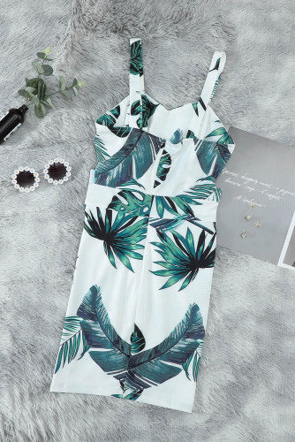 Vibrant white with green tropical print mini dress. The classic sweetheart styling creates a flattering silhouette with trendy side cut-out detailing. High quality fabric offers you a soft and comfortable feel. Dress is a fitted style.