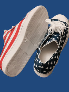 American flag print sneakers.  Comfy insoles, rubber bottom, tie canvas sneaker.  Runs True To Size.  Super nice sneakers! So cute and patriotic also!! 