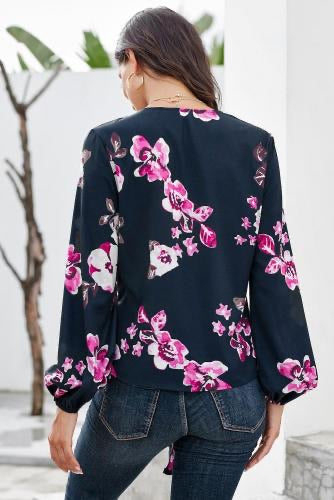 •Casual loose fit with long sleeves  • V-neck and a front tie at the bottom  •Beautiful print pattern silky blouse  •Pair with denim skinnies and heels to complete your look  •Very roomy top, could downsize if you don’t need the bust room! 
