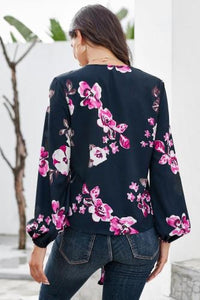 •Casual loose fit with long sleeves  • V-neck and a front tie at the bottom  •Beautiful print pattern silky blouse  •Pair with denim skinnies and heels to complete your look  •Very roomy top, could downsize if you don’t need the bust room! 