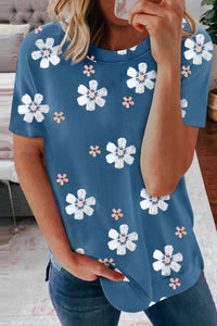 Solid blue tee with white daisy prints. This tee is soft, lightweight and very comfy to wear. Round neck, short sleeve, loose fit with side slits. This short sleeve top is perfect for any summer occasion Pair it with our daisy shorts and jeans! Runs True to Size.