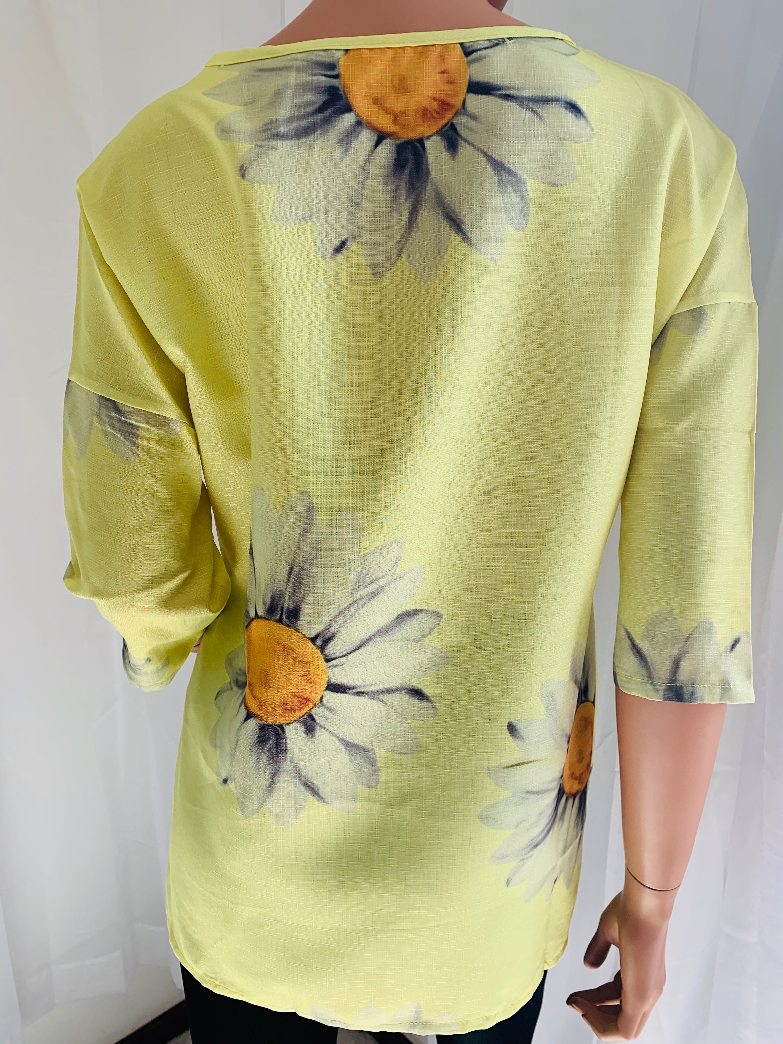 Relaxed fit cotton blend top with 3/4 sleeve. Vivid yellow color and trending daisy design makes this top wearable for any occasion.  Note: No stretch so they fit on the smaller end of size guide. This is a nice quality top! 