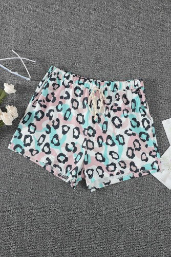 These leopard print shorts are so trendy and cute!! Beautiful pastel colors with elastic waist and drawstring are designed for easy everyday wear. Has side pockets for you to keep essentials. The comfy and lightweight fabric is perfect for summer. These are roomy! Could size down! 