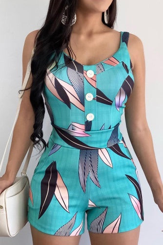 Caribbean blue tropical print romper has button decor, low neckline and high waist with pockets. Has lined upper and made of high quality silky knit fabric with mild stretch. Is more fitted, fabric not sheer. 