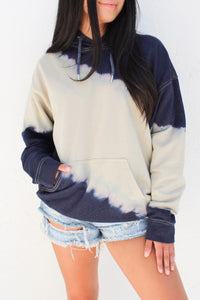 Navy and cream tie dye look hooded sweatshirt with kangaroo front pocket. Perfect for cool nights and fall and winter seasons. Outer has a smooth silky poly knit feel. Runs according to size guide. This is roomy for sizes. 