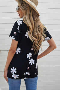 Solid black knit tee with daisy print. This tee is soft, lightweight and airy, very comfy to wear. Round neck, short sleeve, loose fit with side slits. This short sleeve tee is perfect for any summer occasion. Pair it with our daisy shorts and jeans! Runs True to Size.