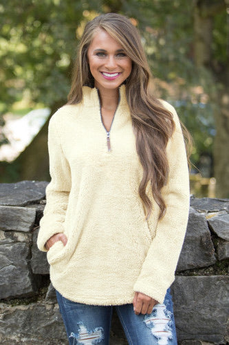 This gorgeous Zipped Fleece Pullover is such a must-have for fall and winter! We are in love with the amazingly soft and fuzzy outer material! This quarter zip pullover has pockets on each side, a faux leather zipper pull detail, and a chic rounded hemline for a stylish combination! And the interior lining feels almost as amazing as the outside! You'll love snuggling up in this gorgeous pullover all season long!