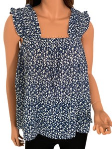 This beautiful floral babydoll is made with a cool cotton blend fabric. It features small white flowers on a navy base. Finished with a square elasticized neckline and elasticized straps with ruffle trim. Perfect piece for summer! Roomy and flowy top! 