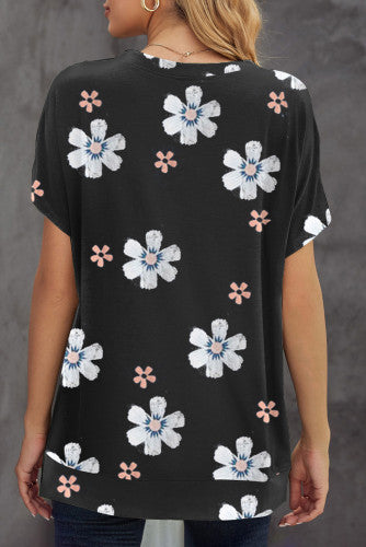 Solid black knit tee with daisy print. This tee is soft, lightweight and airy, very comfy to wear. Round neck, short sleeve, loose fit with side slits. This short sleeve tee is perfect for any summer occasion. Pair it with our daisy shorts and jeans! Runs True to Size.