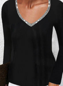 Black long sleeve knit top with sequined trim v-neck design.
