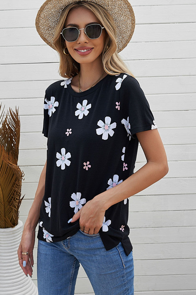 Solid black knit tee with daisy print. This tee is soft, lightweight and airy, very comfy to wear. Round neck, short sleeve, loose fit with side slits. This short sleeve tee is perfect for any summer occasion. Pair it with our daisy shorts and jeans! Runs True to Size.