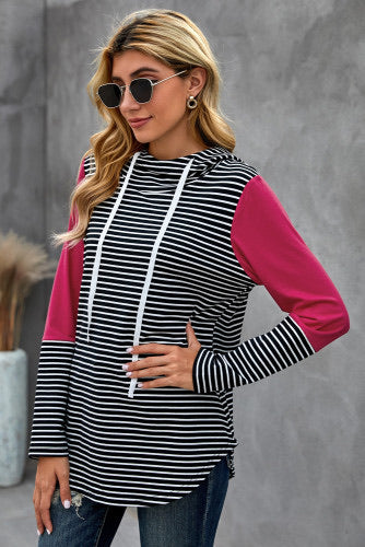 We love a good hoodie that you can layer with, especially as the weather is only going to get cooler.  •This is a great transition piece as you can wear alone and then add a cute coat later on for extra warmth.  •Flattering fit striped print, solid color accent on sleeves.