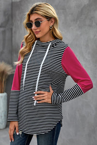 We love a good hoodie that you can layer with, especially as the weather is only going to get cooler.  •This is a great transition piece as you can wear alone and then add a cute coat later on for extra warmth.  •Flattering fit striped print, solid color accent on sleeves.