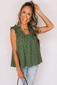 This beautiful floral babydoll is made with a cool cotton blend fabric. It features small black flowers on a green base. Finished with a square elasticized neckline and elasticized straps with ruffle trim. Perfect piece for summer! Roomy and flowy top. 