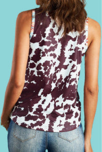 Trendy western all over cow print with Aztec trim pocket sleeveless top. A cool top to wear on hot summer days alone or wear under button down shirts and jackets on cooler days for a trendy look. Tank top has unique burgundy, brown colors and has a one a kind cow print. Nice cool knit fabric, not thin and not too thick. 