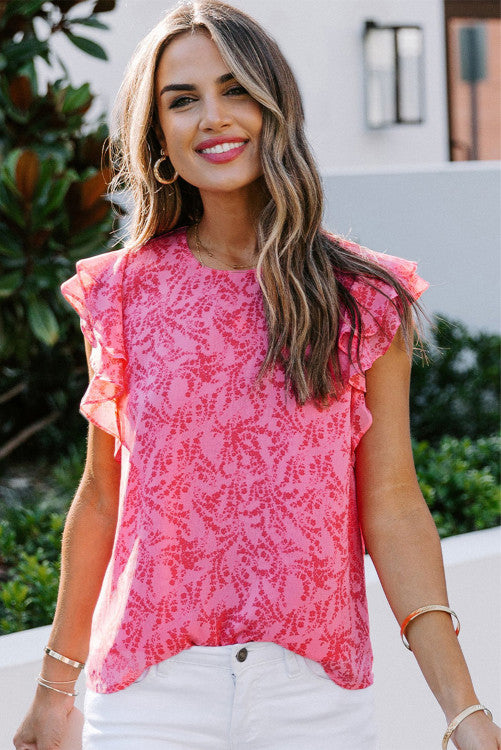 Pink floral print crepe with ruffled flutter cap sleeves blouse. Has back button keyhole closure. Nice relaxed fit top made of lightweight polyester blend no stretch fabric. Great top for warm sunny days. Front bodice is lined. 