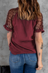 Burgundy polka dot lace short sleeve top. Lace V-neck with a soft silky like bodice and ruffled short sleeves that gives it an elegant look. Nice relaxed roomy fit top. Polyester blend fabric with very mild stretch. Sleeve ruffles are not elastic. 