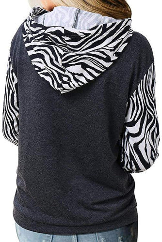 Zebra Print Kangaroo Pocket Half Zip Hoodie  •Chic zebra printed design   •Draw string hoodie  •Half zip closure and kangaroo pocket on the front  •The chic thumb-hole design will keep your hands warm  •Medium Weight Knit 