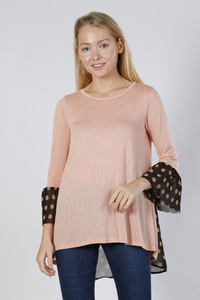 This Pink Polka Dot tunic is so cute and flowy. Made of cotton knit fabric, that’s airy and loose. Has a sheer like back. Pair this any type of bottom to create casual or dressy looks.  Made in the USA! 