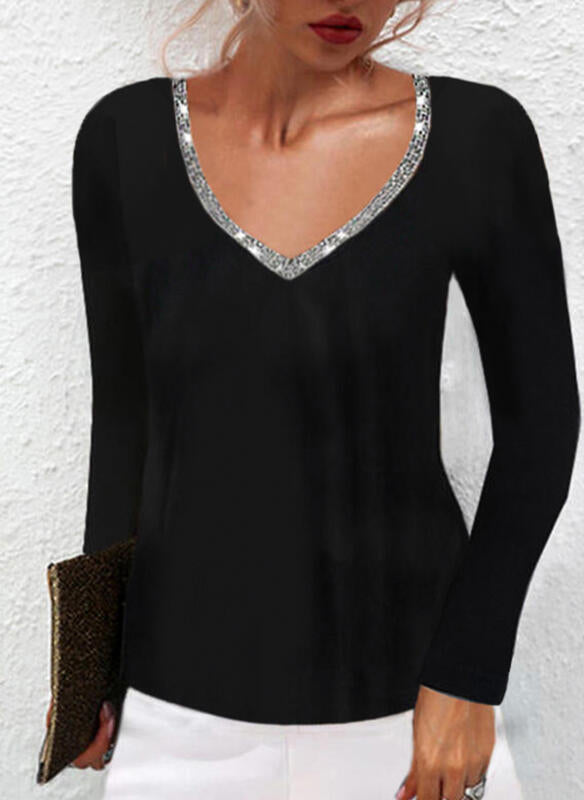 Black long sleeve knit top with sequined trim v-neck design.