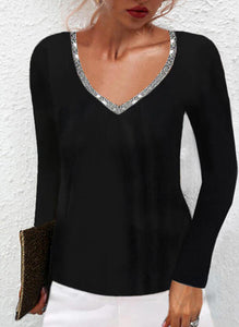 Black long sleeve knit top with sequined trim v-neck design.