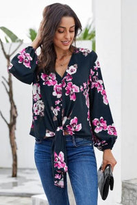 •Casual loose fit with long sleeves  • V-neck and a front tie at the bottom  •Beautiful print pattern silky blouse  •Pair with denim skinnies and heels to complete your look  •Very roomy top, could downsize if you don’t need the bust room! 