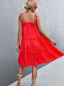 Super cute beautiful red ruffly tiered sun dress with shoulder tie straps. Nice and roomy, lightweight flowy dress that is perfect for hot sunny days. 