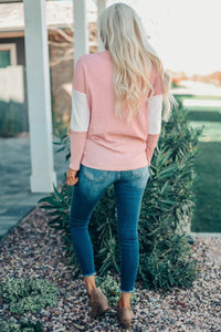 This Pink Color Block Leopard Tie Top Is So Adorable!  •You can never have too much leopard.  •Has a light color block print fabric and long sleeves.  •Tie in the front and a scoop neck.  •Is a roomier fit, downsize if you don’t want it to fit loose. 