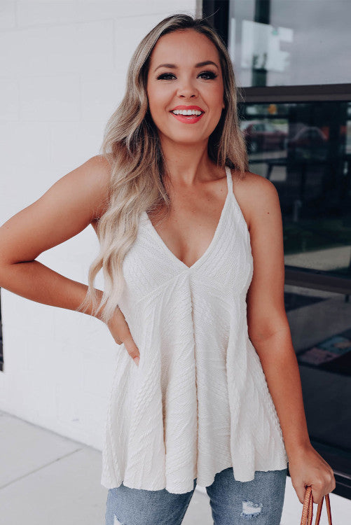 Beautiful white textured babydoll tank, made of high quality fabric. This trendy strappy tank has a V-neck style with babydoll design. This can be worn dressed up or casual. Wear alone or throw on a cardigan for a chic style. 