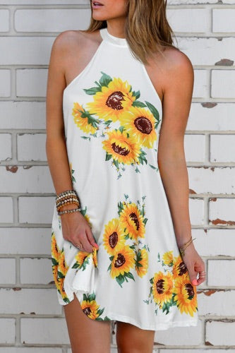 Cool cotton knit sunflower printed halter neck mini dress. Has open back with tie nape. Cool lightweight cotton knit blend fabric that is comfy on those warm sunny days.  Runs true to size chart.