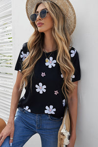 Solid black knit tee with daisy print. This tee is soft, lightweight and airy, very comfy to wear. Round neck, short sleeve, loose fit with side slits. This short sleeve tee is perfect for any summer occasion. Pair it with our daisy shorts and jeans! Runs True to Size.