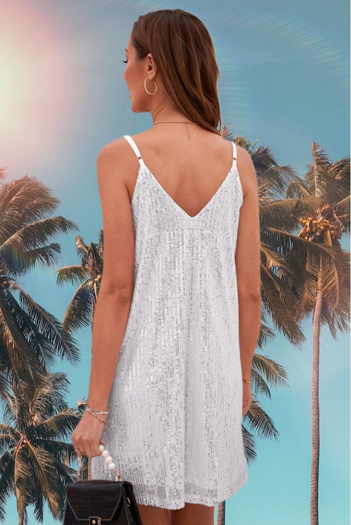 Show up in this beautiful shiny and sparkling white sequin dress to any occasion! Features adjustable spaghetti straps for a perfect fit. Has V-neck and mini length cut with shift style hemline. This dress is fully lined. This sparkling strappy dress is flattering for all shapes and sizes. Nice and Roomy fit! 
