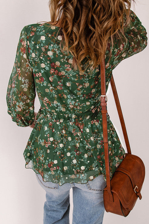 Green floral print blouse with elastic cuffs and waistband for a fitted look. Is fully lined. Designed with a V-Neck and peplum style for a carefree fit. Pair it with jeans, dress pants or even skirts and shorts. This top runs snug so you might want to size up from your regular size from my clothing line. Polyester. 