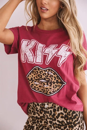 •Soft lightweight cotton blend material  •High rounded neckline, short loose sleeves  •Adorable leopard print lips graphic  •A relaxed silhouette that falls into a straight hemline  •This chic grunge piece can be worn a variety of different ways