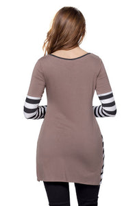 details include pullover long sleeve silhouette, contrast solid color block and striped hem, it has lace stitching and buttons on back.  Is lightweight knit, stretchy   True to size    