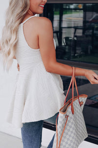 Beautiful white textured babydoll tank, made of high quality fabric. This trendy strappy tank has a V-neck style with babydoll design. This can be worn dressed up or casual. Wear alone or throw on a cardigan for a chic style. 