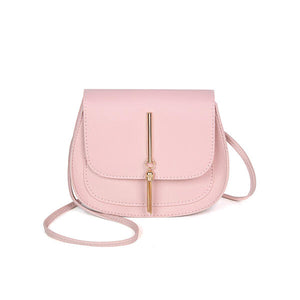 Pink cross body purse. Perfect size for all necessary essentials like cell phone, lipstick and money for a night out, shopping, or a special occasion. Size is 6 x 7 ". Made of PU, with polyester lining and has a magnetic closure. Strap is approximately 46" long.