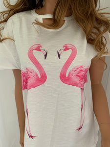 Super cute white tee with pink flamingos  •Chic hollow-out neck  •Crew neck  •Short sleeves  •Front flamingos print  •Classic tee fit  Note: Not a very stretchy material and is a nice  cotton blend fabric 