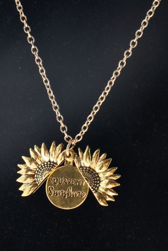 Cute gold sunflower necklace that opens up with a saying inside to brighten up your day.